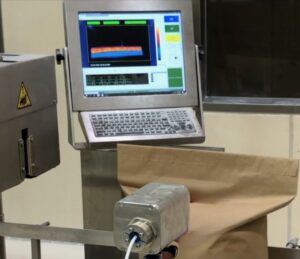 Emitted Energy Advisor Thermal Process Monitoring System monitoring seal integrity on a packaging line with a thermal imaging display and industrial operator interface.